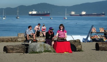 Vendors prepare their stands for the annual 420 event at Sunset Beach in Vancouver, BC., April 20, 2016.