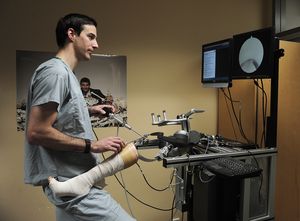 Brad Ashman, a former baseball player at UBC and now a resident at Vancouver General Hospital at work on a patient simulator.