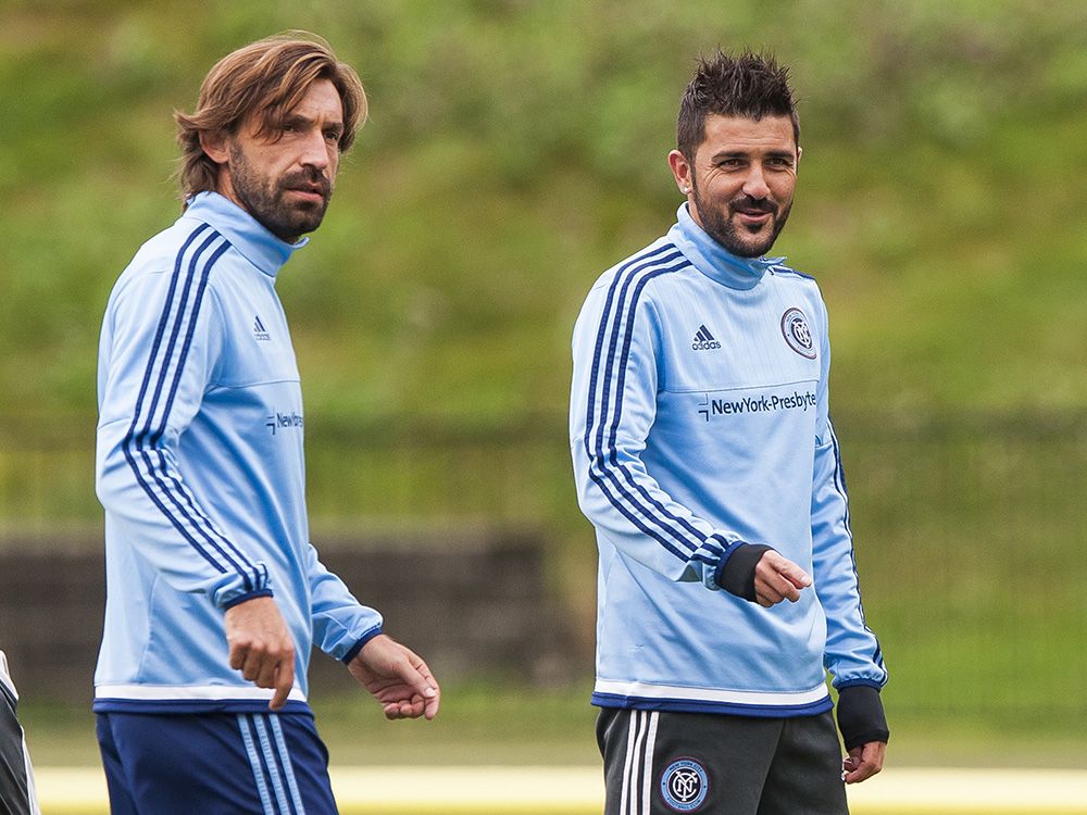 VANCOUVER, B.C.: SEPTEMBER 25, 2015 -- David Villa of New York FC (right) talks with Andrea Pirlo while training with the team at UBC ahead of their game against the Vancouver Whitecaps FC tomorrow, Vancouver, BC, September, 25, 2015. (Richard Lam/PNG) (For Gary Kingston) 00039208A [PNG Merlin Archive]