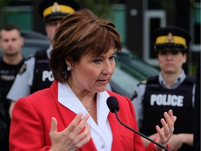 Premier Christy Clark announces $23 million extra to fights gangs in a press conference outside RCMP B.C.'s headquarters in Surrey on Apil 15, 2016.