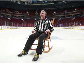 VANCOUVER, BC - MARCH 3:  Off-ice officials presented linesman Brad Lazarowich with a rocking chair as a joke before the Vancouver Canucks played the San Jose Sharks in his last NHL game at Rogers Arena March 3, 2016 in Vancouver, British Columbia, Canada.