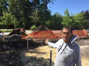 Sechelt Indian Band Chief Calvin Craigan stands in front of a residential lot that is being archeologically excavated after a midden (an ancient garbage dump) was discovered as the owners razed their modest 1960s A-frame to build a larger rancher. Craigan said the lot and others around it sit on a longhouse site that is probably 4,000 years old.