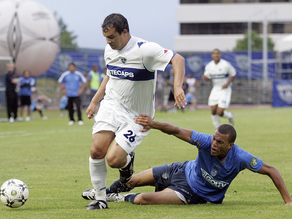 whitecaps-Burnaby, B.C.- 07/14/07- Miami FC Sean Cameron (right) tries to slow up Vancouver Whitecaps Jason Jordan during USL soccer action. (Richard Lam/Vancouver Sun) [PNG Merlin Archive]