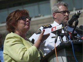 Surrey mayor Linda Hepner (left) and RCMP Asst. Com. Bill Fordy announce measures Friday to fight a spate of shootings in the city.