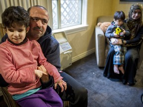 The El Refaie family has moved from temporary housing in a Surrey hotel to a permanent home.