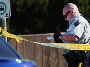 SURREY, BC., May 8, 2015 -- Surrey RCMP on scene at the latest shooting in the city on 128 St between 104 and 105 Ave in Surrey BC., May 8, 2015.  (Nick Procaylo/PNG)   00036516A   [PNG Merlin Archive]