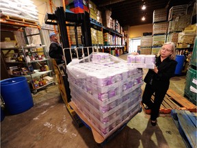 The Surrey Food Bank has seen a surge in clients in recent months. In this file photo, executive director Marilyn Herrmann handles a pallet of baby formula.