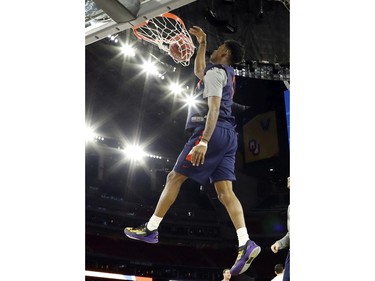 Syracuse's Franklin Howard dunks during a practice session for the NCAA Final Four college basketball tournament Friday, April 1, 2016, in Houston.