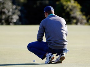 AUGUSTA, GEORGIA - APRIL 09:  Jordan Spieth of the United States lines up a putt on the 14th green during the third round of the 2016 Masters Tournament at Augusta National Golf Club on April 9, 2016 in Augusta, Georgia.