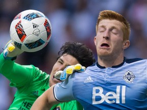 ‘What the referee decides is what it's going to be, but I think in the back of your mind you kind of know that in every tackle there could be a rash decision made,’ says Vancouver Whitecaps centre back Tim Parker (right), here vying with L.A. Galaxy goalkeeper Brian Rowe for the ball last Saturday at B.C. Place Stadium.