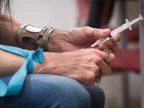 A person injects hydromorphone at the Providence Health Care Crosstown Clinic in the Downtown Eastside. A Vancouver study suggests severely addicted heroin users could be treated with an injectable pain medication. The Study to Assess Longed-Term Opioid Medication Effectiveness, or SALOME, found hydromorphone is as effective as a pharmaceutical-grade heroine for people who do not respond to methadone or suboxone.