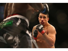 Robert Whittaker stalks Clint Hester in their middleweight bout in the UFC Fight Night 55 event at Allphones Arena on Nov. 8, 2014 in Sydney, Australia.