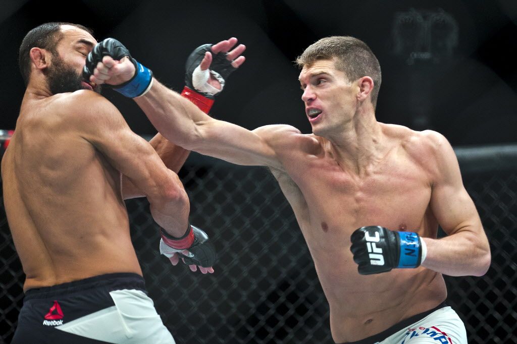 Welterweight Johny Hendricks takes a shot to the chin from Stephen Thompson during their UFC Fight Night 82 match at the MGM Grand Garden Arena in Las Vegas on Saturday, Feb. 6, 2016. 