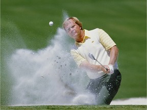 Jack Nicklaus of the United States chips out of the sand bunker on April 10, 1986 during the U.S. Masters Golf Tournament at the Augusta National Golf Club in Augusta, Ga.