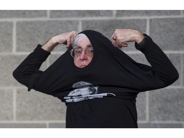 Fan Bob Bailey puts on a concert t-shirt prior to attending the Paul McCartney concert at Rogers Arena, Vancouver April 19 2016.