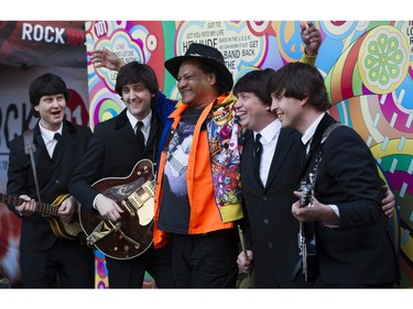 VANCOUVER April 19 2016. Johnny Hendrix poses for a photo with The Day Trippers a Beatle tribute band prior to attending the Paul McCartney concert at Rogers Arena, Vancouver April 19 2016.( Gerry Kahrmann  /  PNG staff photo)  ( For Prov / Sun Entertainment )  00042656c Story by Franois Marchand  [PNG Merlin Archive]