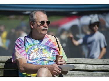 A man attends the annual 4:20 marijuana event at it's new location, Sunset Beach, Vancouver April 20 2016.