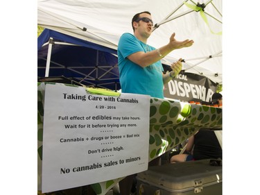 The Mr Bud Dispensary shows the rules for buying at the annual 4:20 marijuana event at it's new location at Sunset Beach, Vancouver April 20 2016.