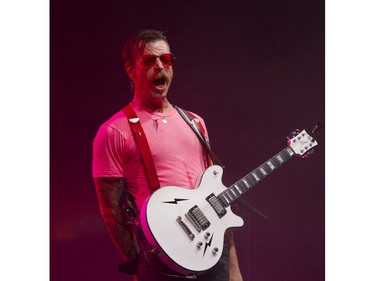 Eagles of Death Metal: Jesse Hughes, lead singer of the band thrills fans at the P.N.E. Forum in Vancouver on April 26, 2016.