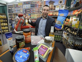Michael Guidi of Bosa Foods shows off some of the unique fare at the grocery show, which starts Monday, at the Vancouver Trade and Convention Centre. Mark van Manen/PNG