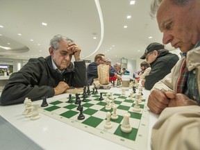 People play chess at Park Royal Mall food court in West Vancouve.