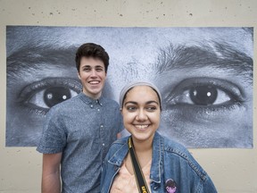 Connor Krezan and Manjot Kaur are photographers at Seaquam Secondary. Students are raising money and awareness of Syrian refugees by selling their art at an auction on Monday.
