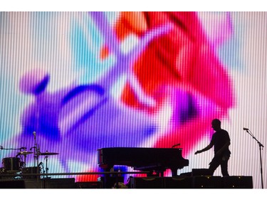 A road crew member checks the piano on the stage prior to Paul McCartney's performance at Rogers Arena in Vancouver, B.C. Tuesday April 19, 2016.