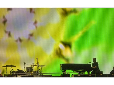 A road crew member checks the piano on the stage prior to Paul McCartney's performance at Rogers Arena in Vancouver, B.C. Tuesday April 19, 2016.