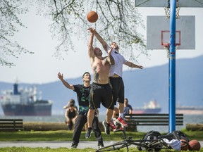 Basketball players took to shorts and T-shirts at Kitsilano Beach during unusually warm weather this week. Scientists say the Pacific Ocean blob that led to our warm winter has gone, but it return.