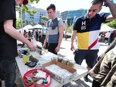 Vendors prepare their stands for the secondary 420 event at the Vancouver Art Gallery in Vancouver, BC., April 20, 2016.