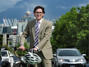 New Vancouver city manager Sadhu Johnston on his bike outside city hall, in Vancouver, BC., April 21, 2016.