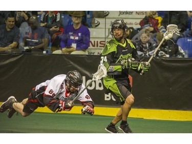 Vancouver Stealth #88 Ian Hawksbee loses his footing while chasing   Saskatchewan Rush #75 Jeremy Thompson in National Lacrosse League action at the Langley Event Centre in Langley, BC. April 23, 2016.