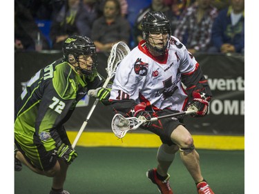 Vancouver Stealth   Rhys Duch gets by Saskatchewan Rush Adrian Sorichetti in National Lacrosse League action at the Langley Event Centre in Langley, BC. April 23, 2016.