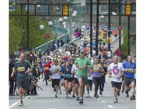 Runners power toward the Vancouver Sun Run finish line.