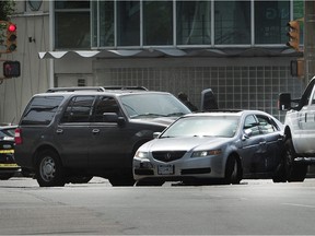 Police attend a three-car collision that caused traffic jams for three hours on Quebec Street near Science World in Vancouver, April 27, 2016. A 36-year-old man was arrested after a series of crimes committed in Richmond and Vancouver.