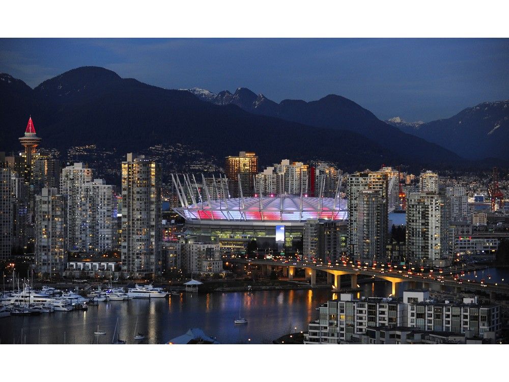 Vancouver , BC. December 12, 2011 Glowing in the evening light downtown Vancouver glows in the dusk light, showing off the new B.C. PLACE stadium over false creek in Vancouver on December 12, 2011. The clear weather is sadly coming to end on tuesday. (Mark van Manen/PNG Staff see Vancouver Sun /Province News stories ) 00057958A [PNG Merlin Archive]