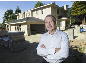 UBC geography professor David Ley in front of a large house being built on Yew Street in Vancouver, BC Ley is the author of Millionaire Migrants, and is an expert on how migration and foreign investment relates to housing prices.