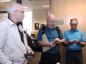 A trio of recently retired Vancouver Sun sports writers — left to right Brad Ziemer, Gary Kingston and Elliott Pap (in his case, last year) — in the Sun newsroom on Ziemer’s and Kingston’s final day at work last week.