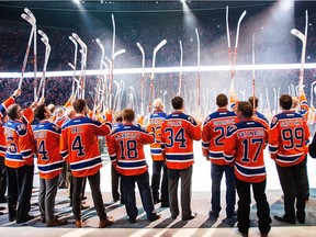 Edmonton Oilers alumni salute the fans during the closing ceremonies for Rexall Place following the home team’s 6-2 win over the visiting Vancouver Canucks on Wednesday.