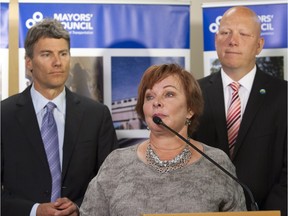 Mayors Gregor Robertson, left, Lynda Hepner and Greg Moore all benefited from extra pay for their work as Metro directors.