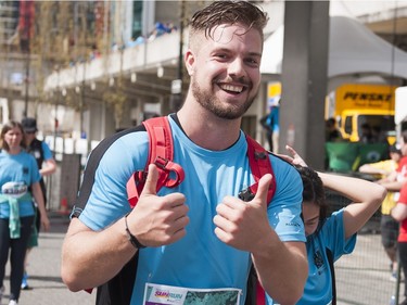 VANCOUVER,BC:APRIL 17, 2016 -- A runner celebrates after crossing the finish line of the 2016 Vancouver Sun Run in Vancouver, BC, April, 17, 2016. (Richard Lam/PNG) (For ) 00042786A [PNG Merlin Archive]