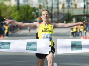 Eric Gillis crosses the finish line as the first male in the 2016 Vancouver Sun Run in Vancouver, BC, April, 17, 2016.