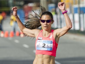 Lanni Marchant crosses the finish line as the first female in the 2016 Vancouver Sun Run in Vancouver, BC, April, 17, 2016.