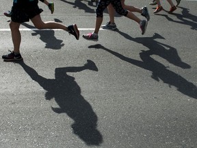 Runners make their way along the course of the 2016 Vancouver Sun Run in Vancouver, BC, April, 17, 2016.