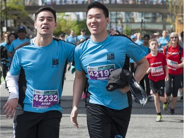 VANCOUVER,BC:APRIL 17, 2016 -- Runners cross the finish line of the 2016 Vancouver Sun Run in Vancouver, BC, April, 17, 2016. (Richard Lam/PNG) (For ) 00042786A [PNG Merlin Archive]