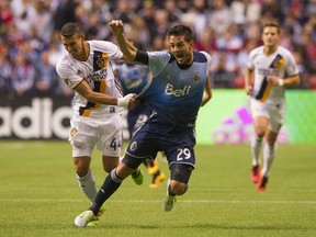 Vancouver Whitecaps Octavio Rivero #29 reacts after getting pulled down by L.A. Galaxy Daniel Steres #44 during MLS soccer action at BC Place Stadium in Vancouver, BC, April, 2, 2016.