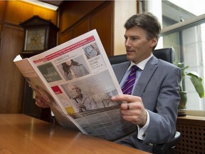 Mayor of Vancouver Gregor Robertson reads the new look Vancouver Sun.
