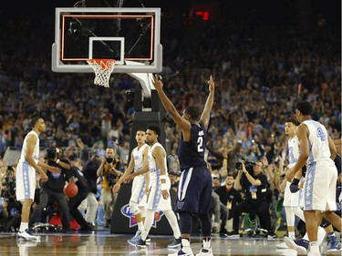 Villanova's Kris Jenkins (2) reacts to his gamne winning three point basket at the conclusion of the NCAA Final Four tournament college basketball championship game against North Carolina, Monday, April 4, 2016, in Houston. Villanova won 77-74.