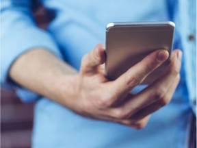 Man holding cellphone.