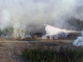 As several major wildfires rage in northeastern British Columbia, Prince George RCMP are still searching for the person, or people, suspected of sparking a forest fire one year ago. The Bobtail Lake blaze was first spotted on May 8, 2015. The Little Bobtail Lake wildfire, southwest of Prince George is shown on Wednesday, May 13, 2015.